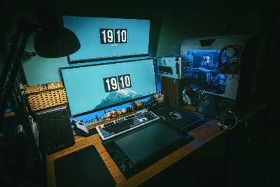 A gaming setup with a monitor, keyboard, and desktop PC